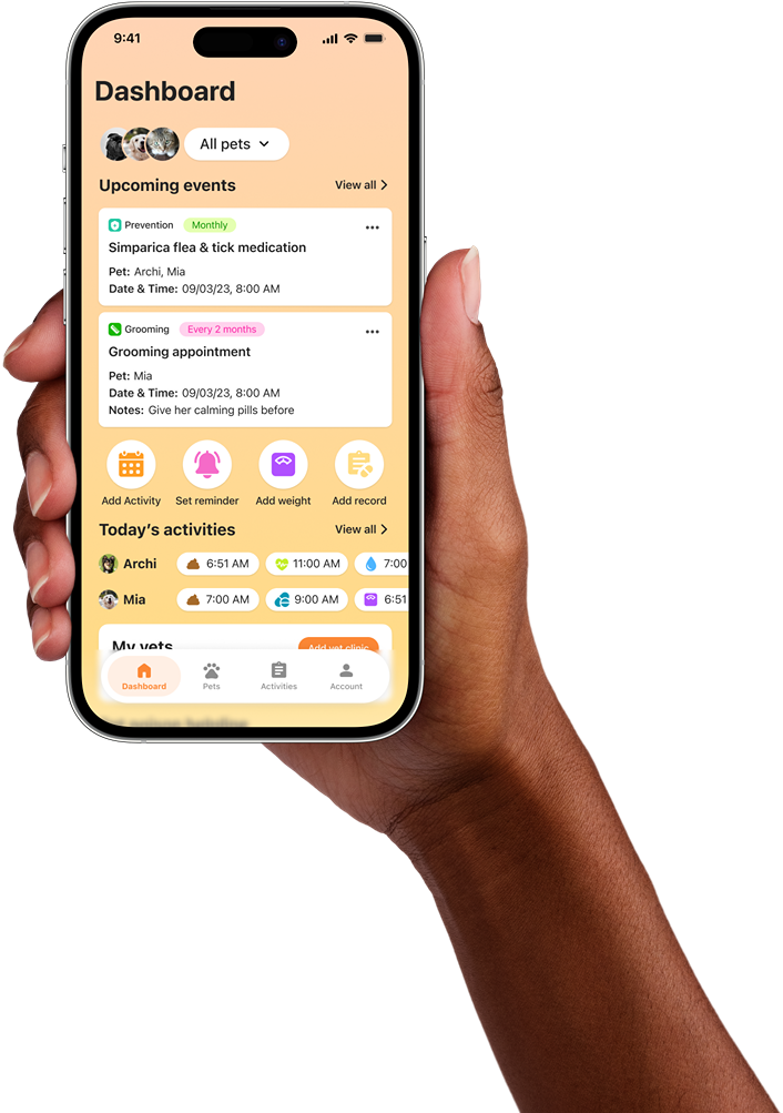 a hand holding a phone with pet pawfolio app opened